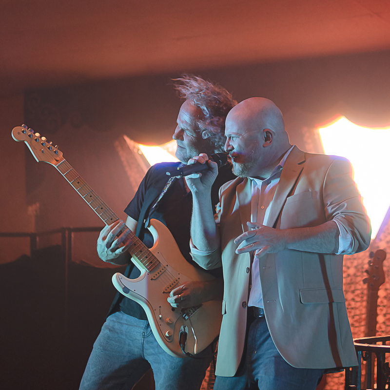 Singer and guitarist playing music of Phil Colins.